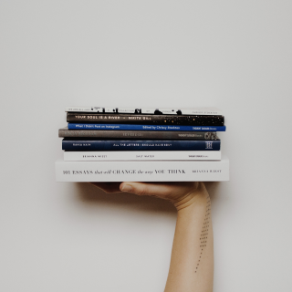 Hand with books
